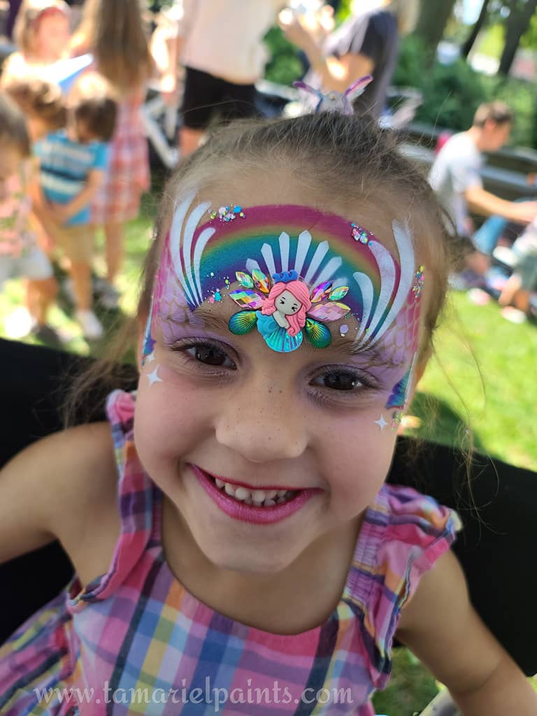 A child with airbrush face paint design