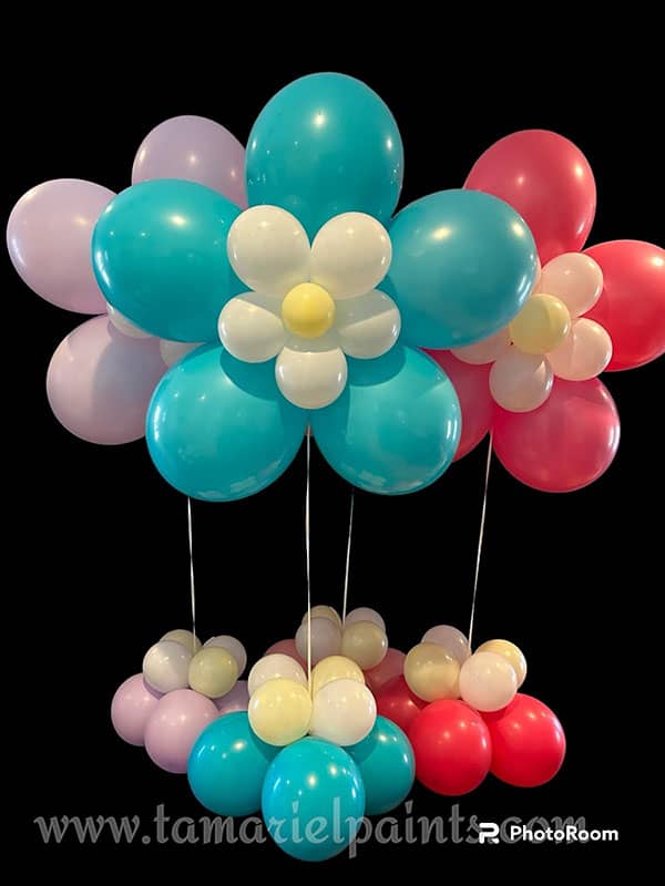 Colorful blue pink and red balloons in the shape of large flowers