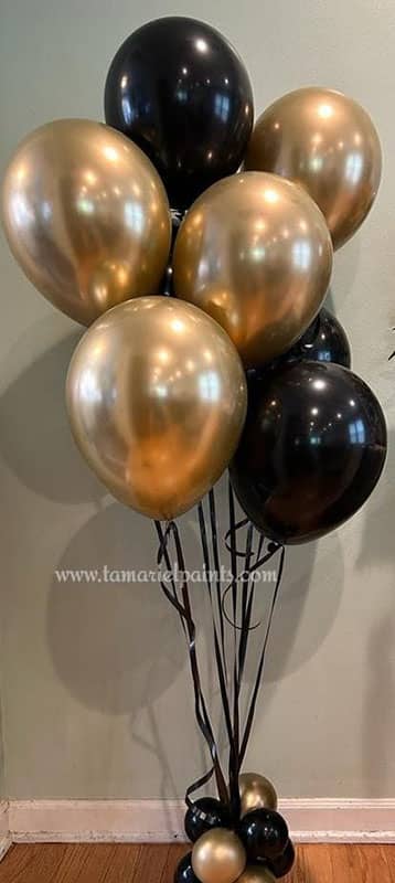 A copper and black balloon display