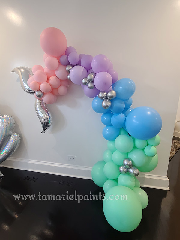 A photo of a balloon display in the shape of a fish