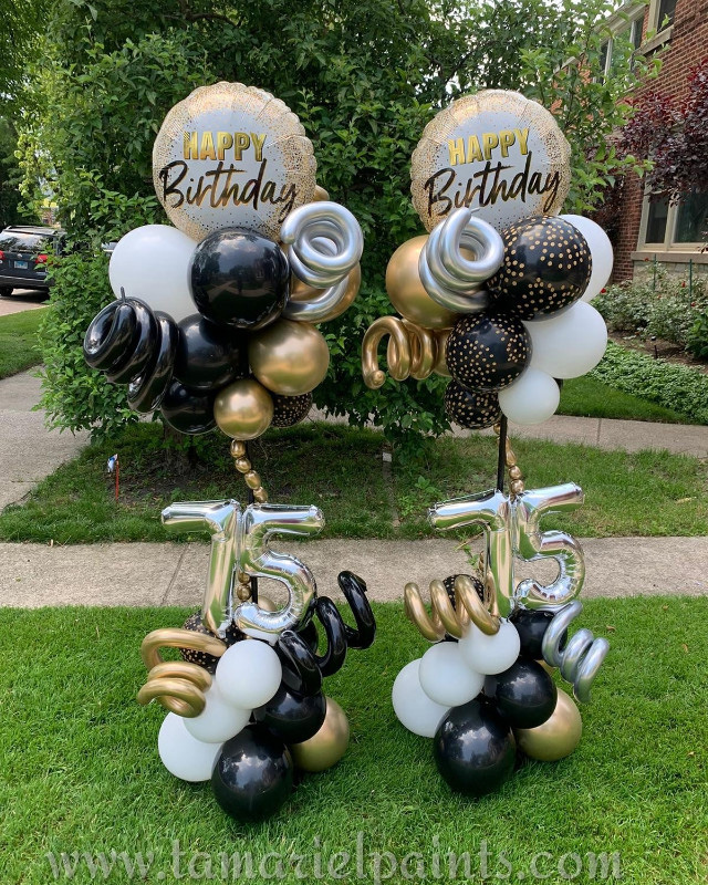 A photo of an artistic balloon display for a 75th birthday party