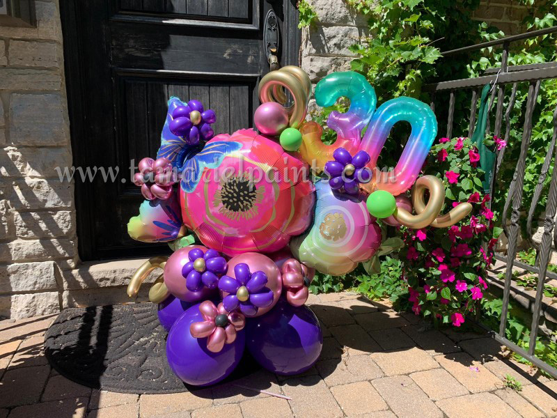 A photo of a colorful and creative balloon display for a 30th birthday party