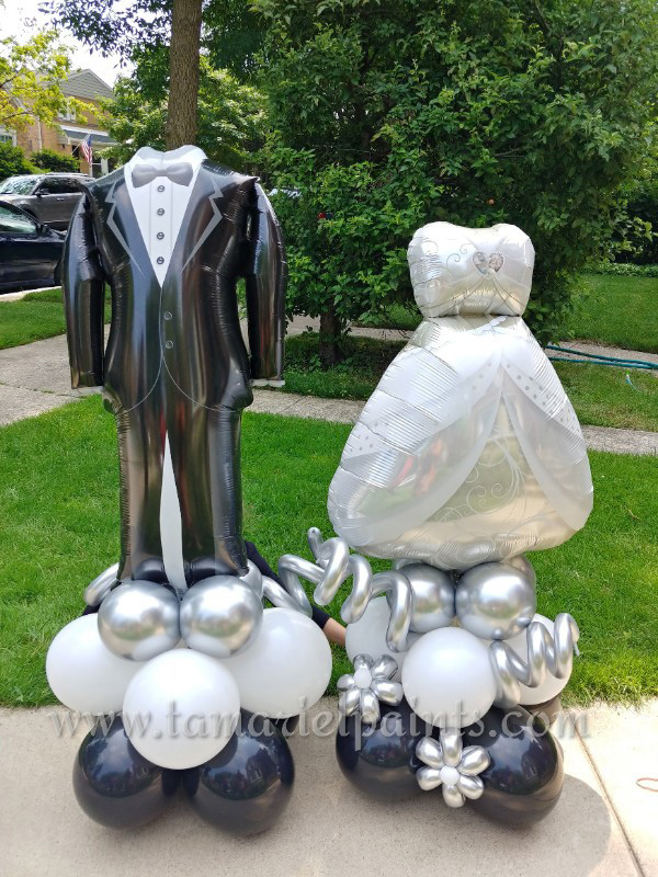 A photo of a bride and groom balloon display