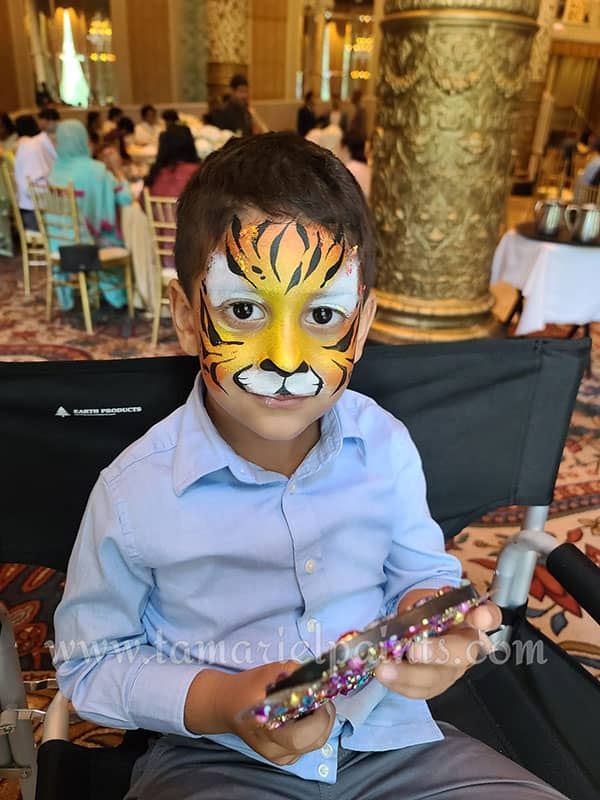 A boy with tiger face paint