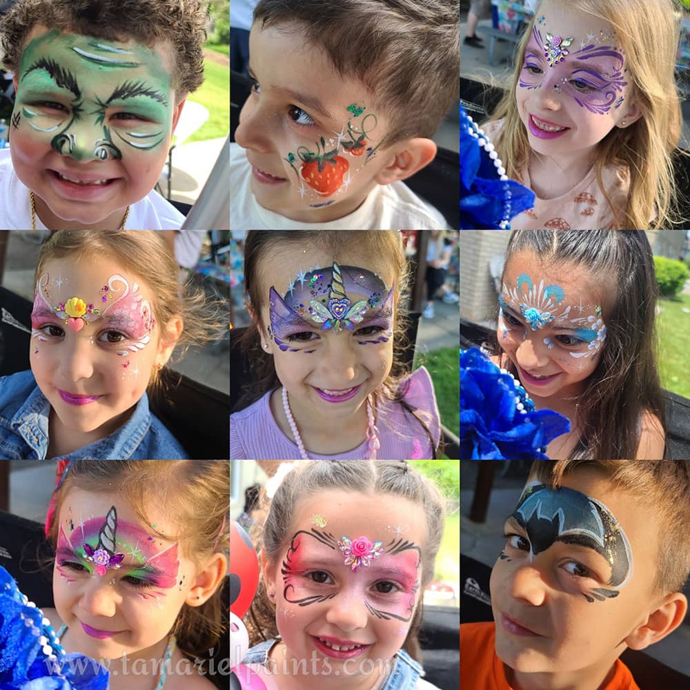 A girl with colorful mermaid themed face paint