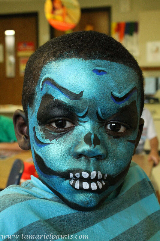 A boy with full face paint