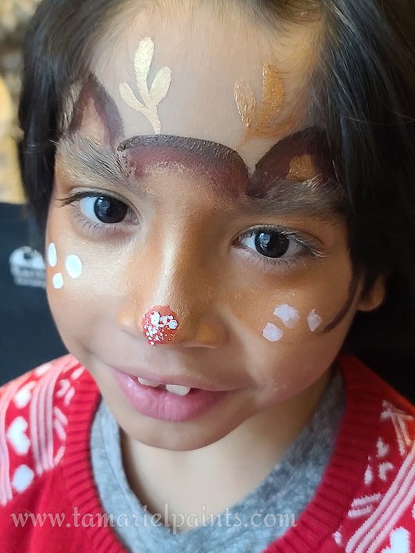 A girl with animal face paint