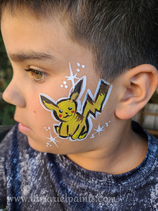 A boy with cartoon character face paint