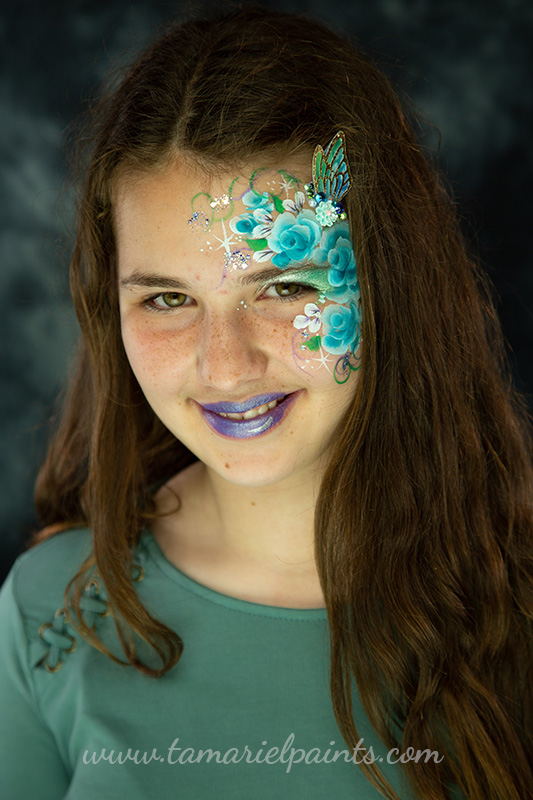 A girl with floral face paint