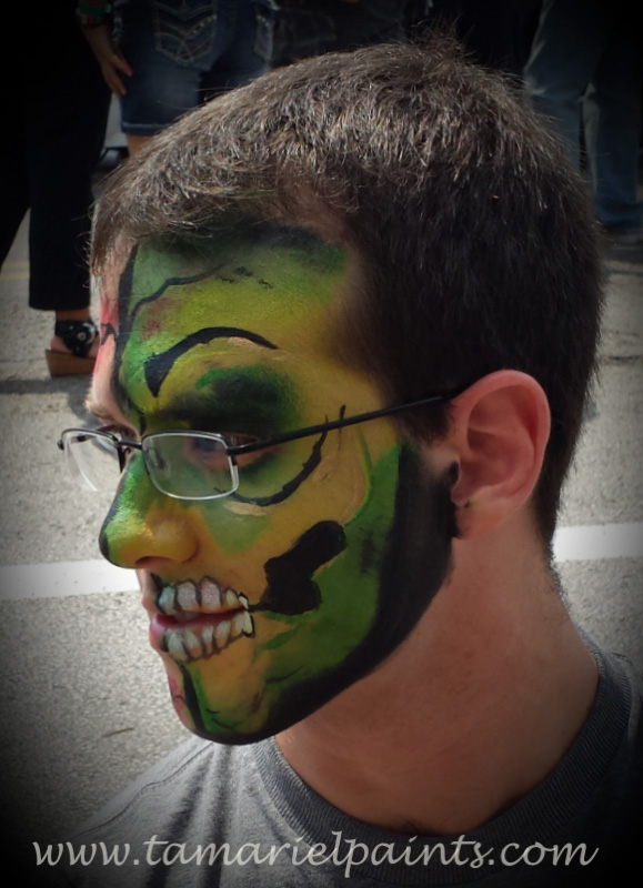 A man with camo style face paint