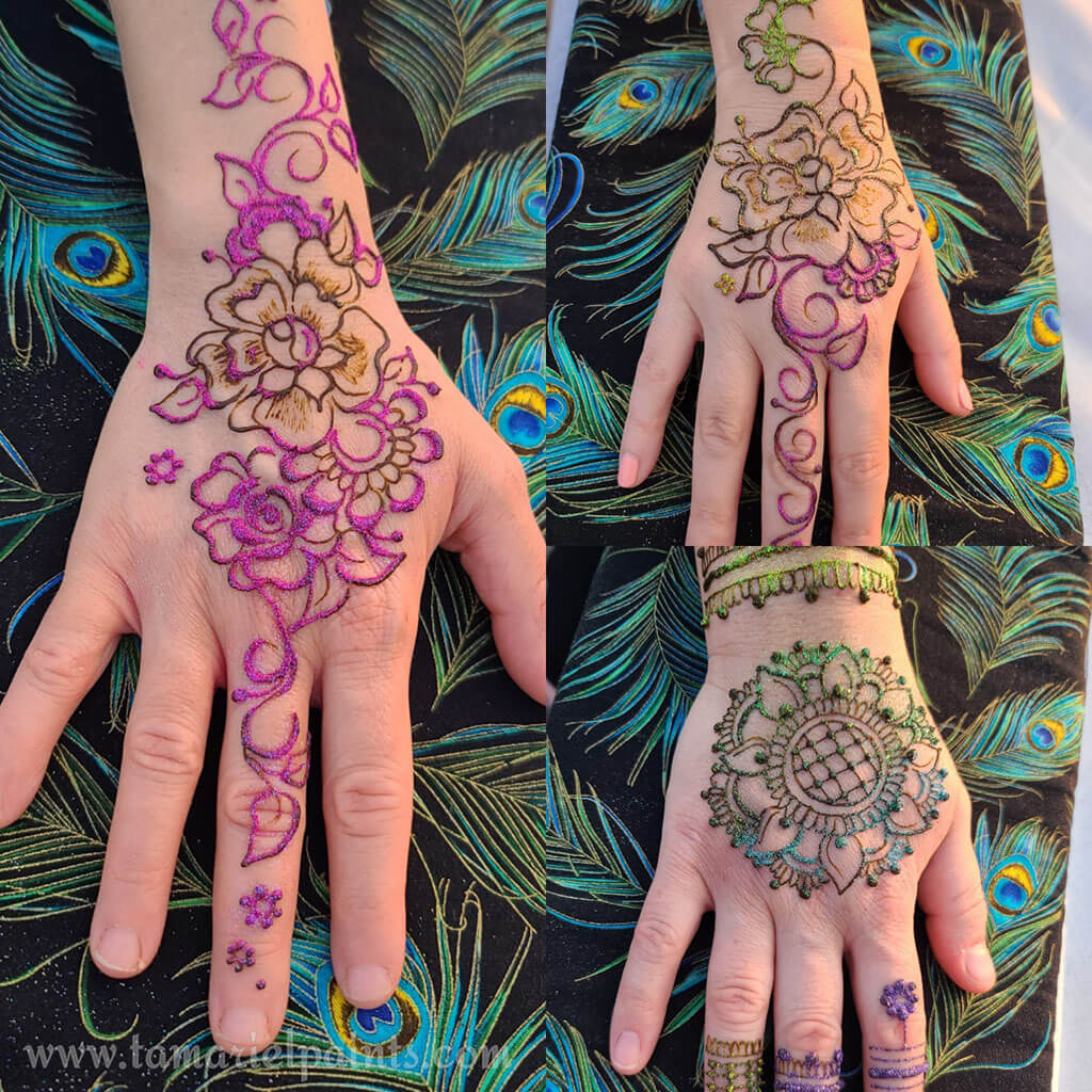 A hand with an intricate floral henna tattoo pattern