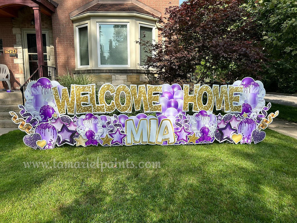 A photo of a custom made yard sign which reads Welcome Home Mia