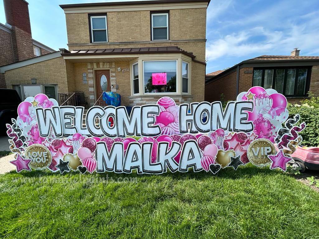 A photo of a custom made yard sign which reads Welcome Home Malka