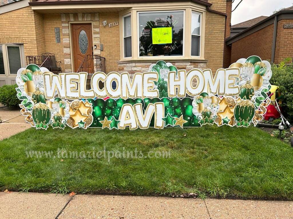 A photo of a custom made yard sign which reads Welcome Home Avi