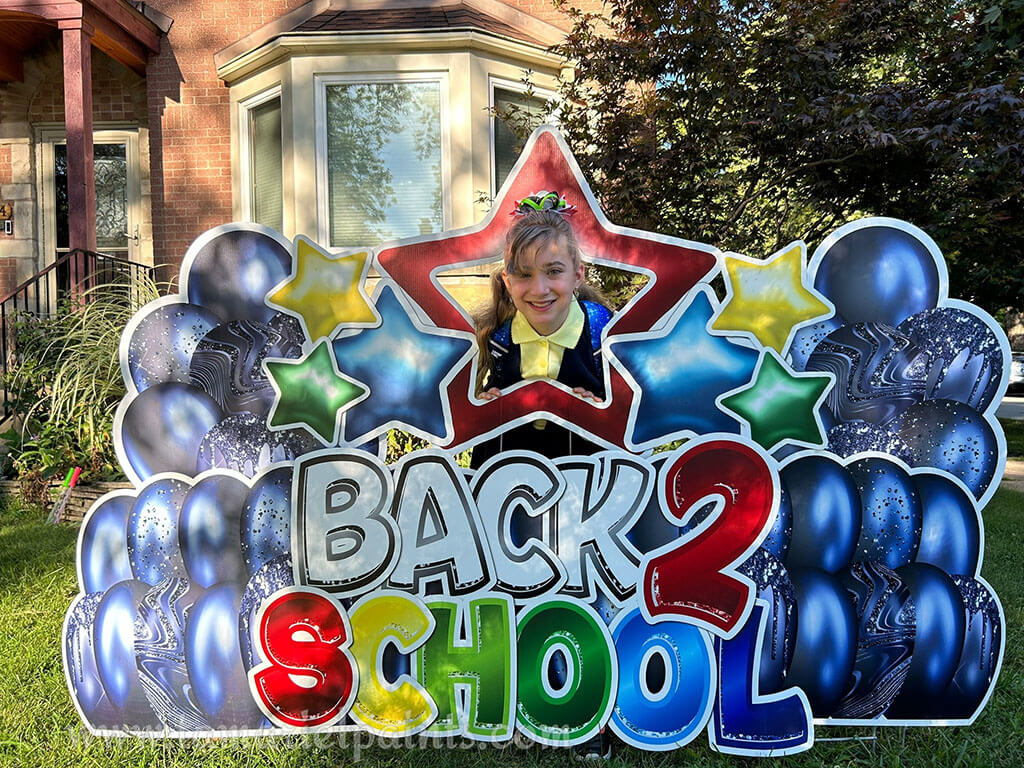 A photo of a custom made yard sign which reads Back 2 School