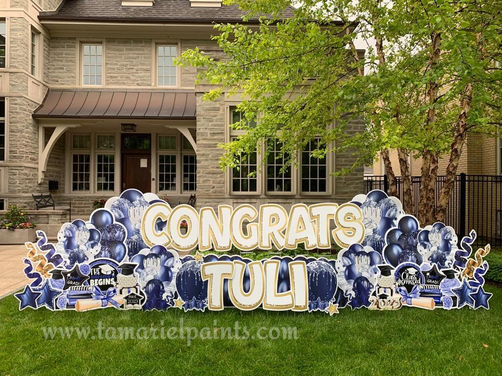 A photo of a custom made yard sign which reads Congrats Tuli