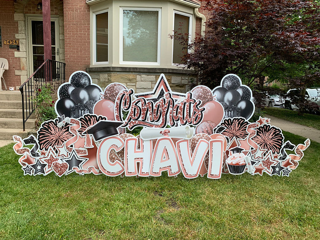 A photo of a custom made yard sign which reads Congrats Chavi