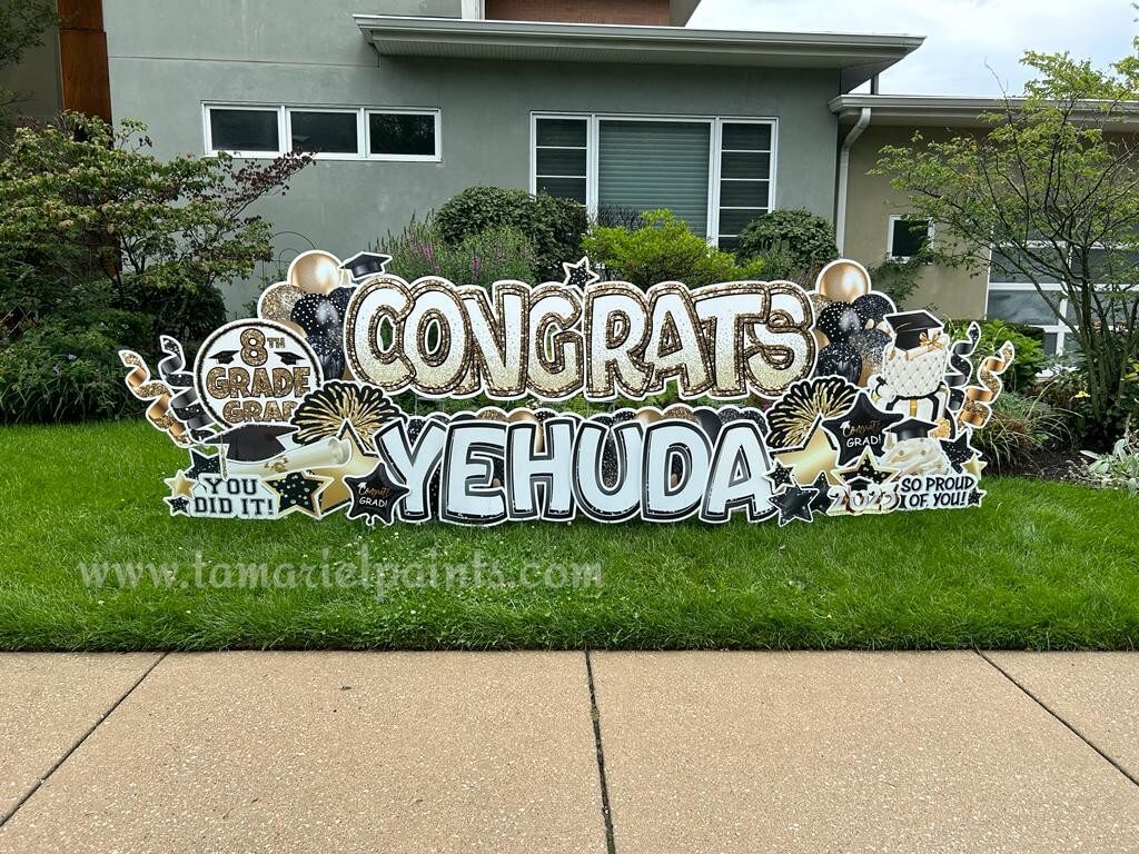 A photo of a custom made yard sign which reads Congrats Yehuda