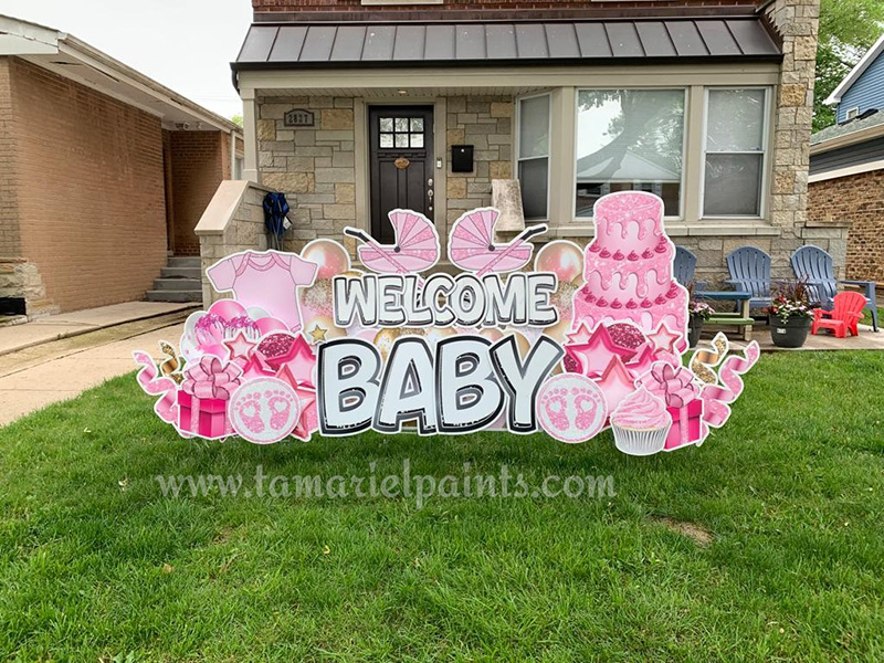 A photo of a custom made yard sign which reads Welcome Baby