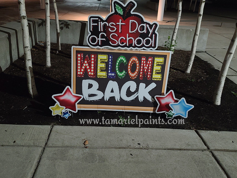 A photo of a custom made yard sign which reads First Day of School Welcome Back