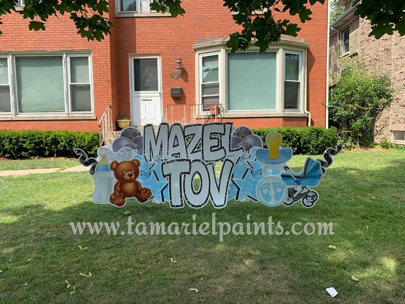 A photo of a custom made yard sign which reads Mazel Tov