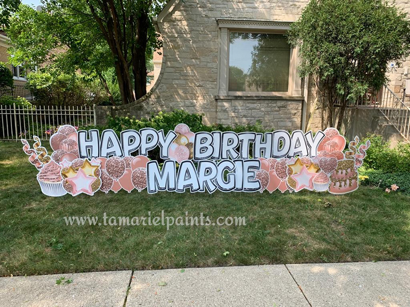 A photo of a custom made yard sign which reads Happy Birthday Margie