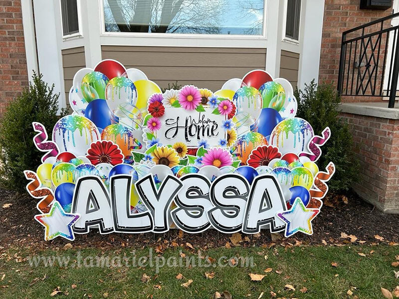 A photo of a custom made yard sign which reads Welcome Home Alyssa