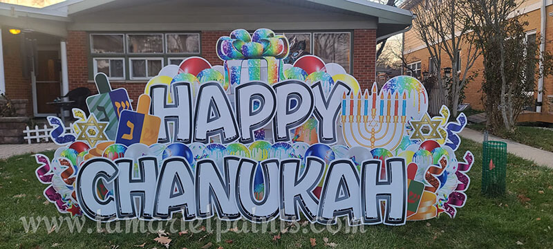 A photo of a custom made yard sign which reads Happy Chanukah